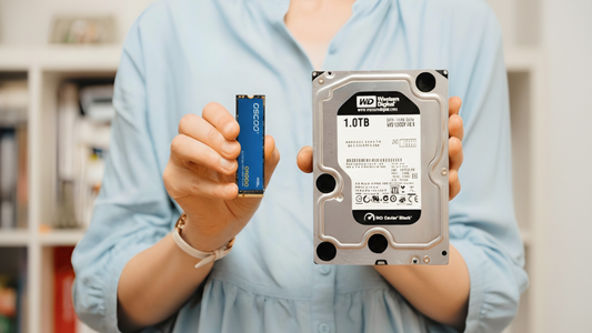 Woman holding OSCOO ON900 M.2 NVMe SSD and WD 1TB 3.5-inch HDD side by side, showing the size difference between modern SSD and traditional hard drive