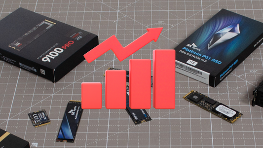 a lot of SSDs on the desk with a red price rising sign